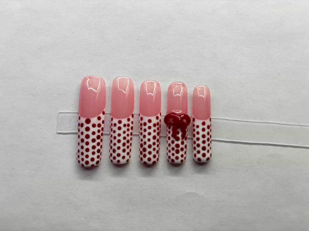 White tipped, red polka dots.