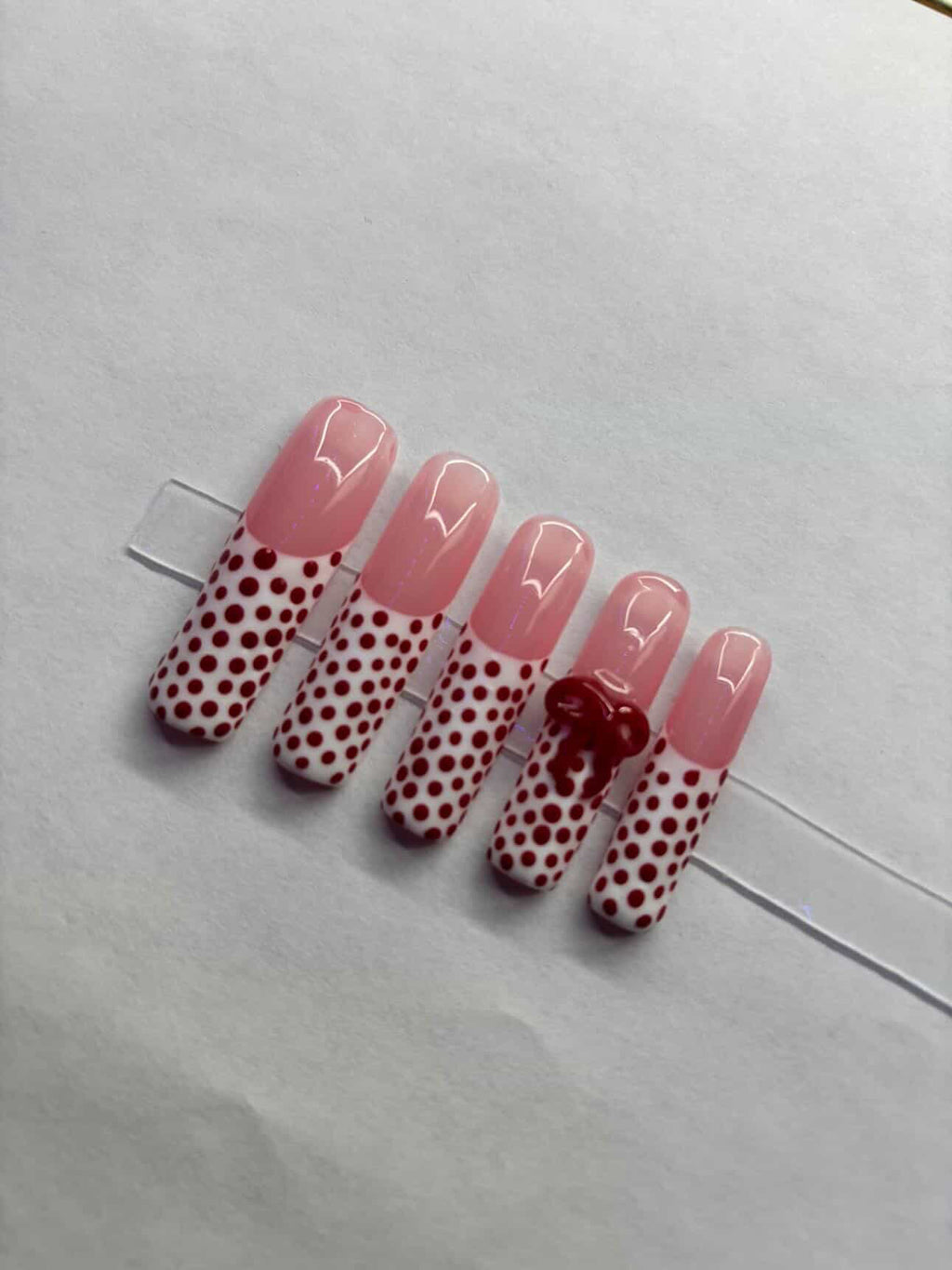 White tipped, red polka dots.